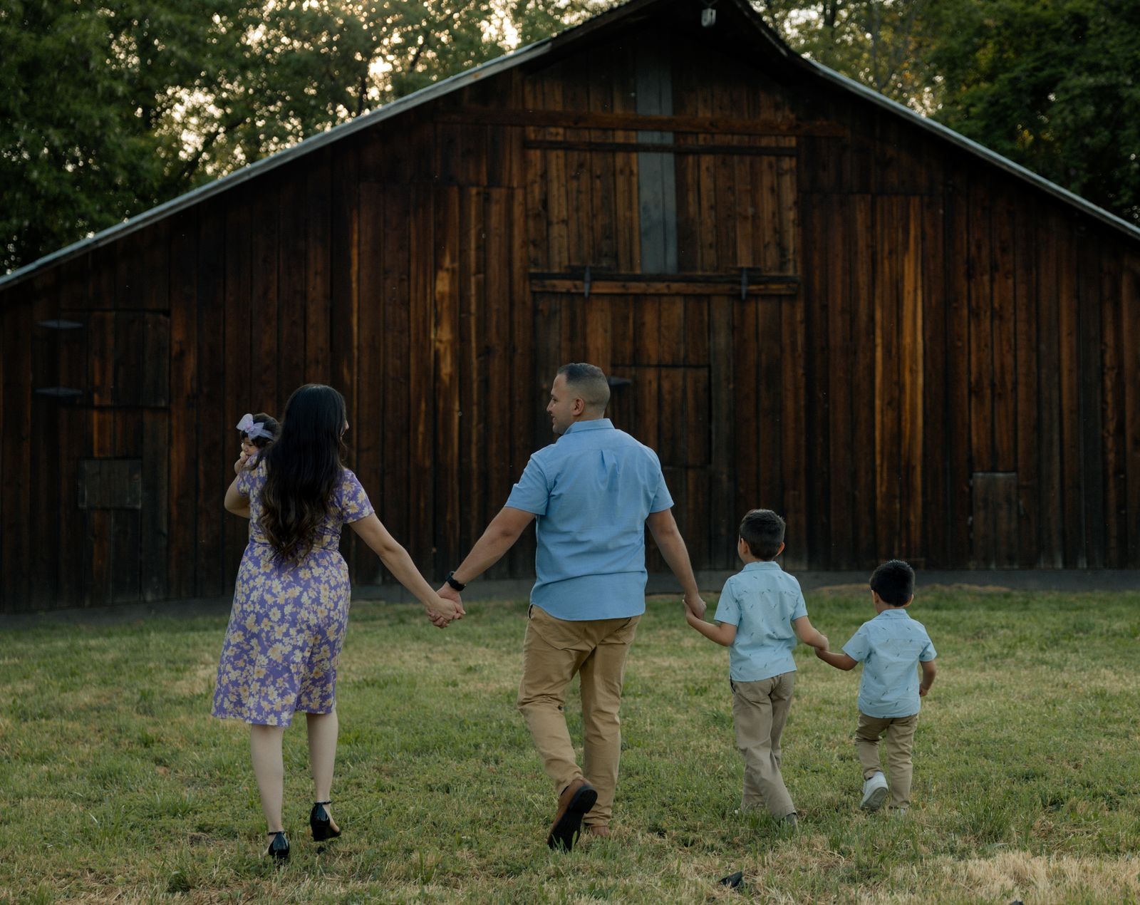 Juan Mendoza with his family outside a barn